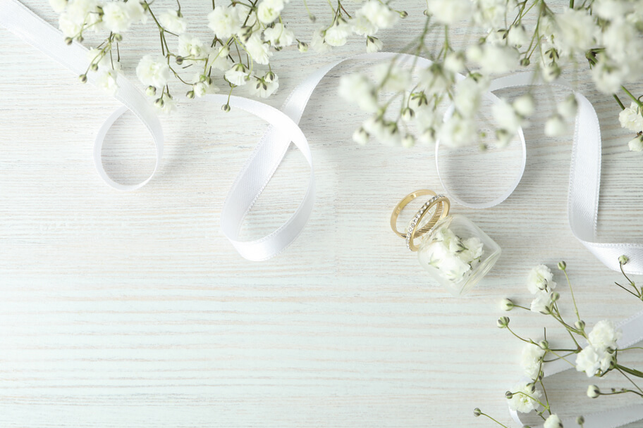 concept-wedding-accessories-with-wedding-rings-white-wooden-background-2